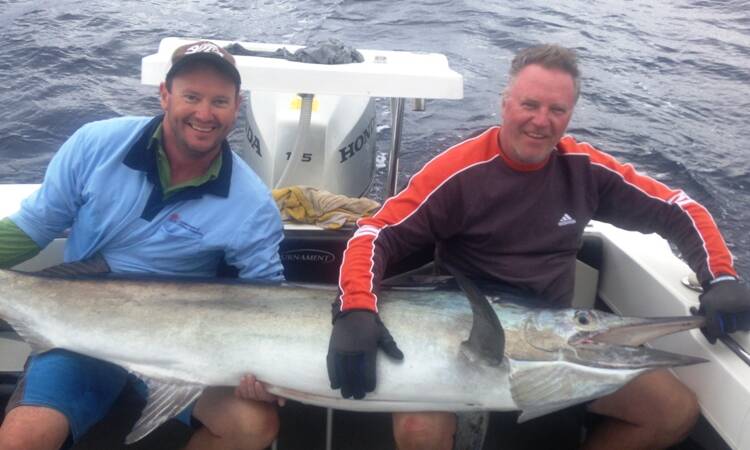GOOD DAY OUT: Marty Asmus and Craig Harris with a black marlin caught at Bermagui. Send your fishing pictures to craig@waggamarine.com.au.