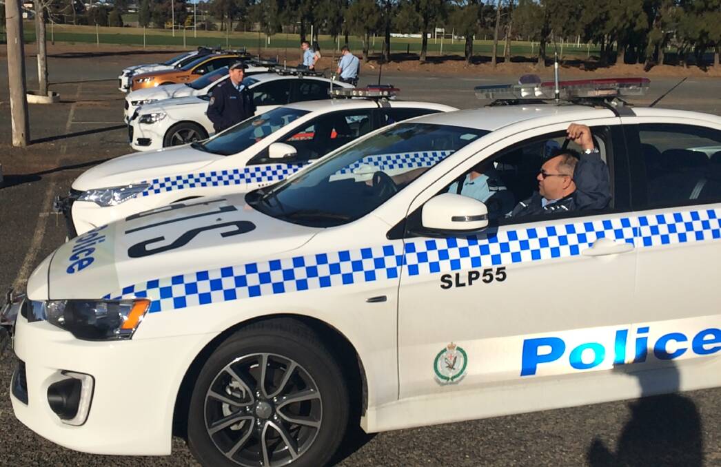 THIN BLUE LINE: Police line up ready to search Tolland and Ashmont for a missing 16-year-old described as an indigenous male, who's wanted on a string of property offences.