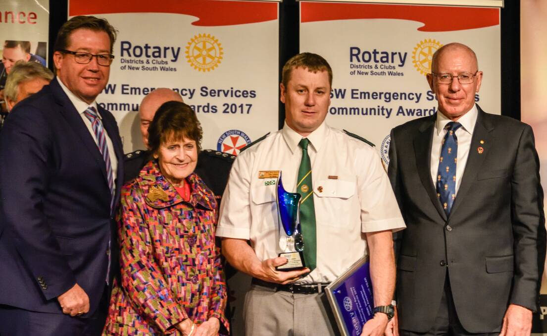 LOCAL HERO: Rotary volunteer officer of the year Tim Lidden (centre) with Police Minister Tony Grant, Rotary's Dot Hennessy and NSW Governor David Hurley in Sydney.