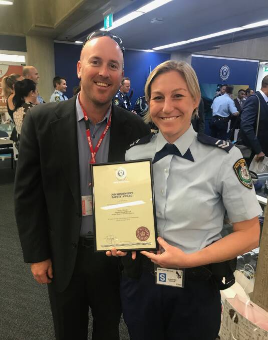 EXTRAORDINARY: Senior Constable Ingrid Gunthorpe, with husband Grant, with her Commissioner's Safety Award for her courage.