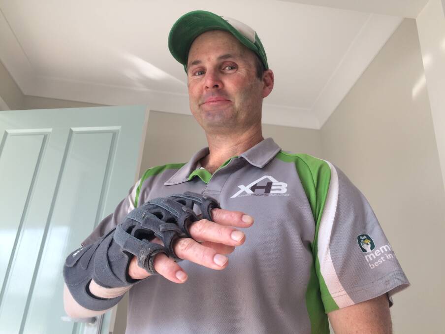 HANDY MAN: Wagga Builder Xavier Higgins is getting more movement in his hand surprising doctors who initially thought he'd have to lose his arm after a building accident. Picture: Marguerite McKinnon