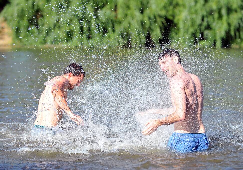 CHILLING OUT: Wagga brothers Daniel O'Dea and Brendan O'Dea duke it out in the Murrumbidgee. Picture: Kieren L Tilly