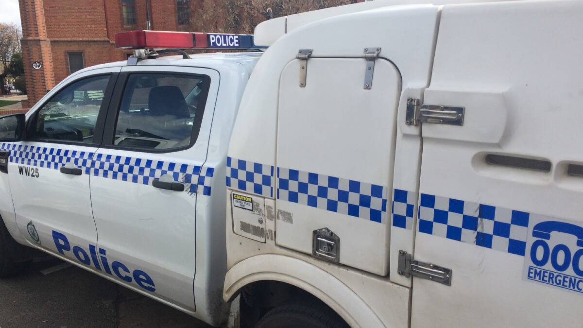 TOUGH: The scuffed police car after it was attacked with a pushbike near the back-left passenger door handle. Picture: Marguerite McKinnon
