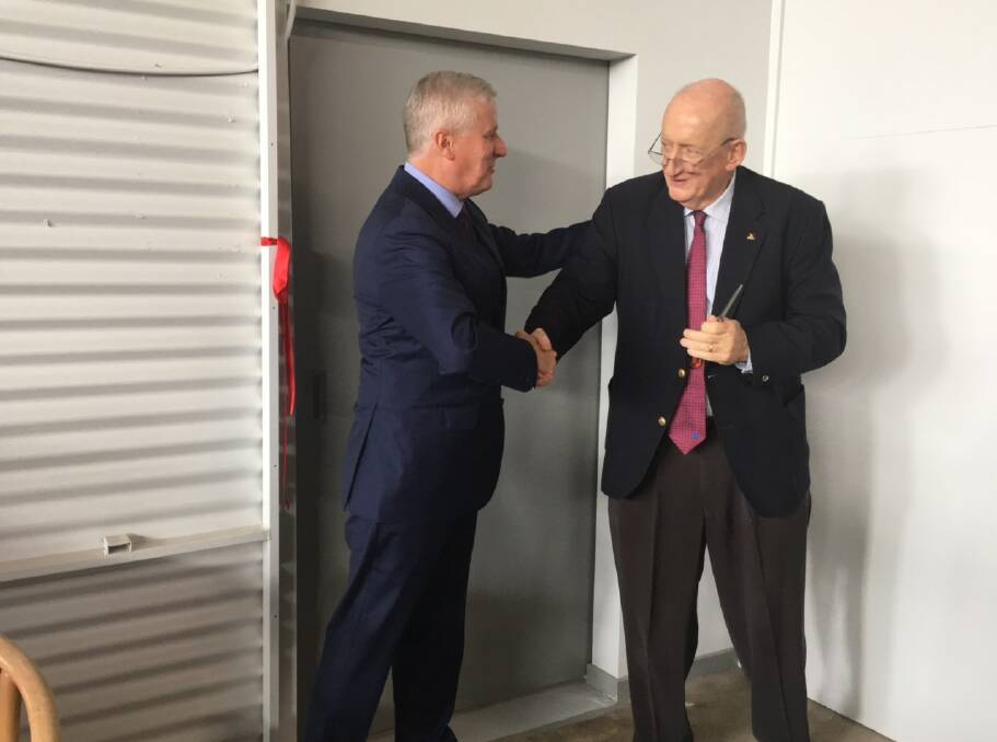 Well done: Nationals federal leader Michael McCormack congratulates his predecessor Tim Fischer on the opening of the new gallery after they both cut a ribbon.