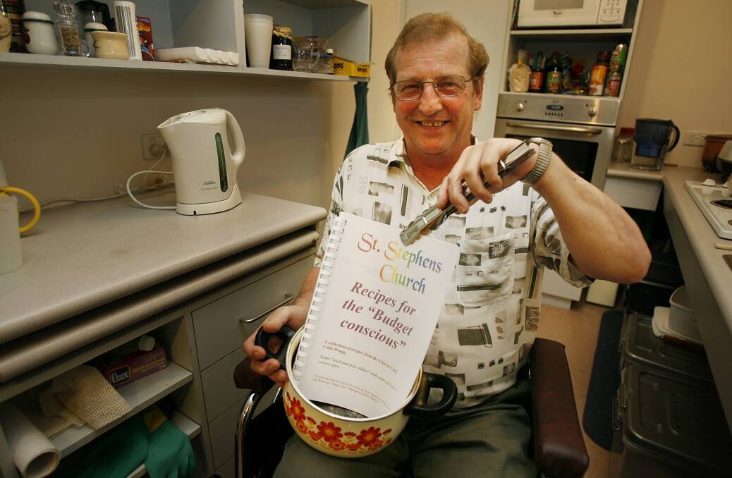 Proud chef: Colin Wragg in 2007 with his Recipes for the Budget Conscious, compiled while he ran cooking classes at St Stephen's Uniting Church.