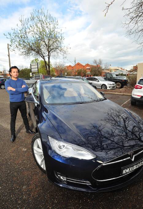 PLUGGED IN: Wagga-based software developer Dev Mukherjee wants to see Tesla bring its car charging stations to the city. Picture: Kieren L Tilly