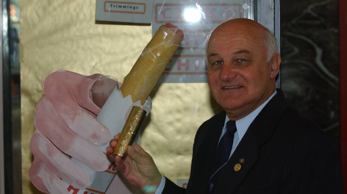 RECOGNITION: Former Wagga mayor Kevin Wales with the city's Golden Chiko Roll at its presentation in 2001, marking 50 years since the iconic snack had its first sale anywhere in the world at the Wagga Show.