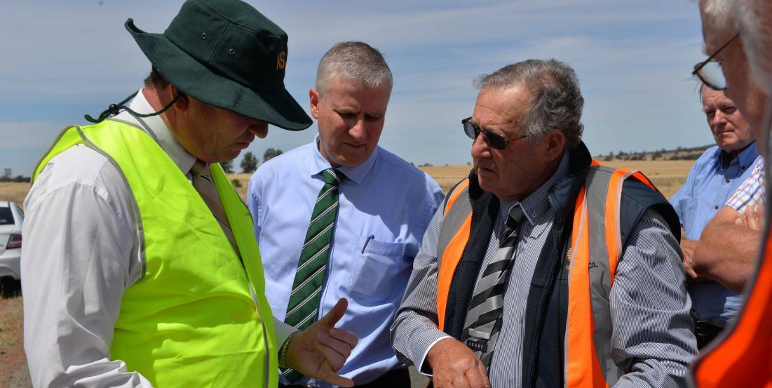 WORTH EXPLORING: Agriculture Minister Barnaby Joyce reviews plans for a dam at Lake Coolah with Member for Riverina Michael McCormack and Griffith mayor John Dal Broi in November.
