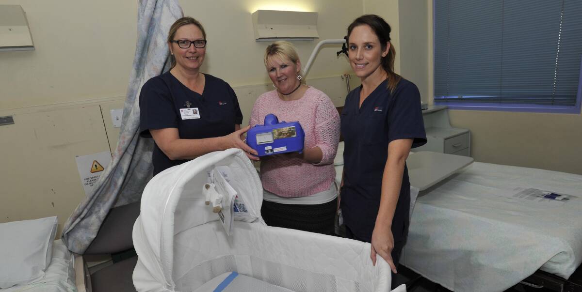 EQUIPMENT: Emerikus Land Foundation co-founder Sherri-Leigh Land (centre) with Wagga Base Hospital acting midwifery unit manager Sandra Forde and midwife Carly Fisher with the hospital's new Cuddle Cot. Picture: Les Smith