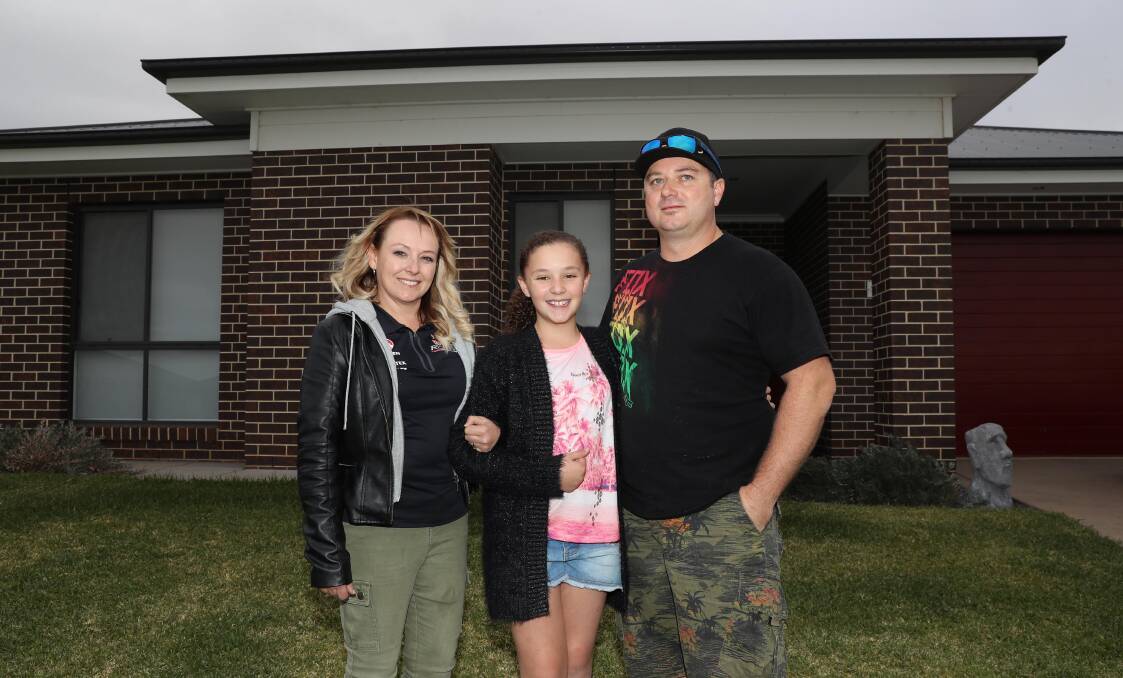 DREAM HOME: Christine, Keira and Brendan Jones made the move from Sydney to Wagga after realising the difference in house prices. Picture: Les Smith 