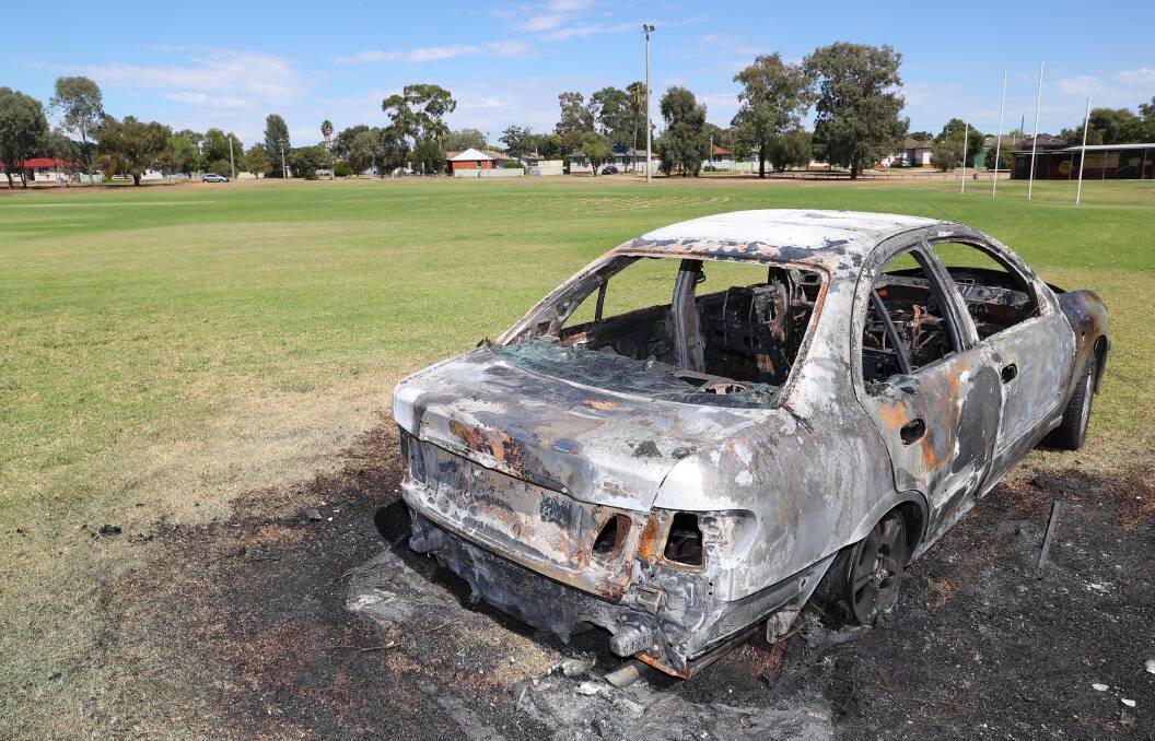 BLAZING CARS: The car was set alight and left on Jack Mission Oval in Ashmont in February, just one of the many instances of deliberate vehicle fires this year. Pictures: Kieren L Tilly