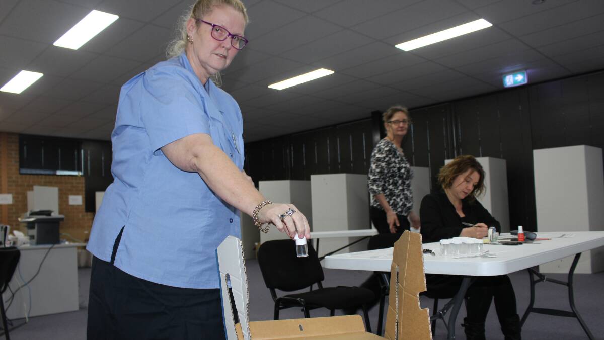 Returning officer Jan Mitchell conducts the ballot draw in Griffith on Wednesday afternoon. Photo: Hannah Higgins 