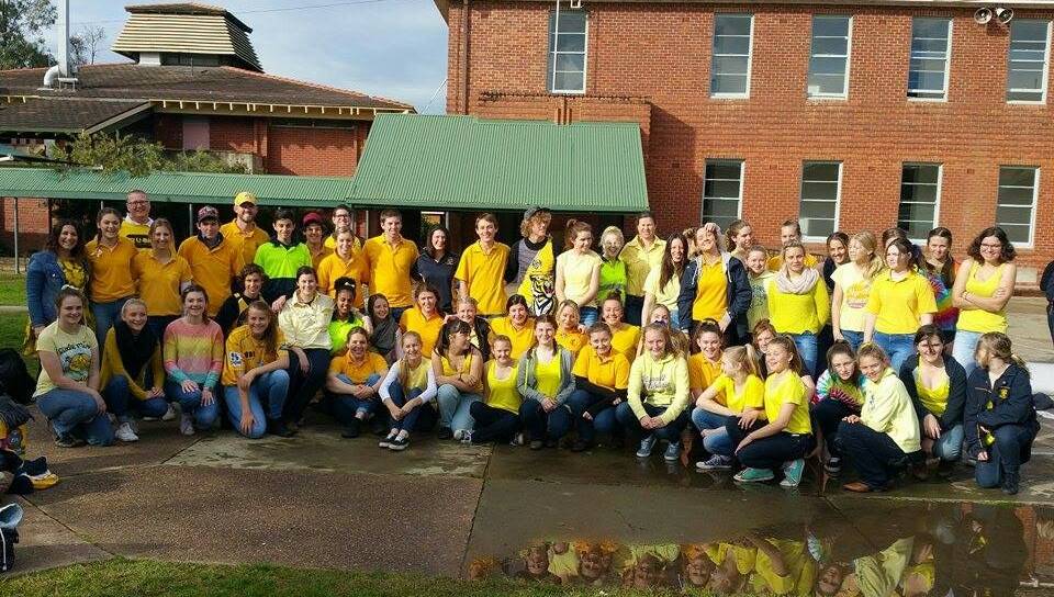 TRIBUTE: Yanco Agricultural High School students and staff wear yellow during a recent fund-raiser to honour the late Stephanie Scott. 