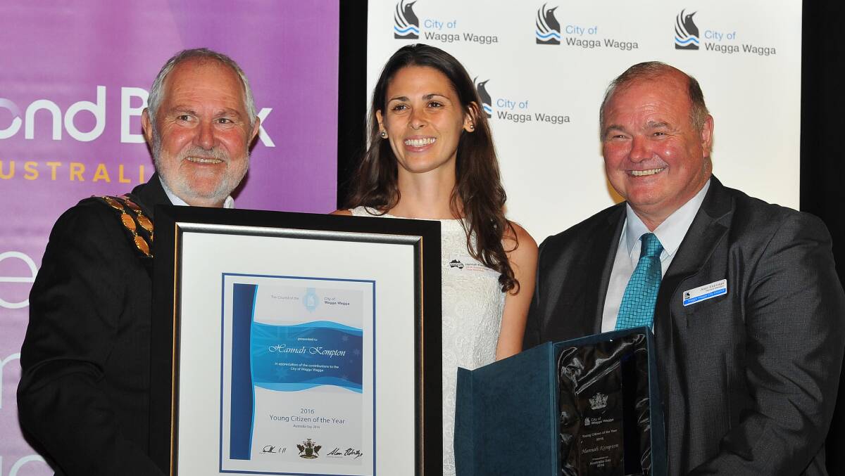 HONOURED: Young Citizen of the Year Hannah Kempton accepts the award from Wagga mayor Rod Kendall and council general manager Alan Eldridge.