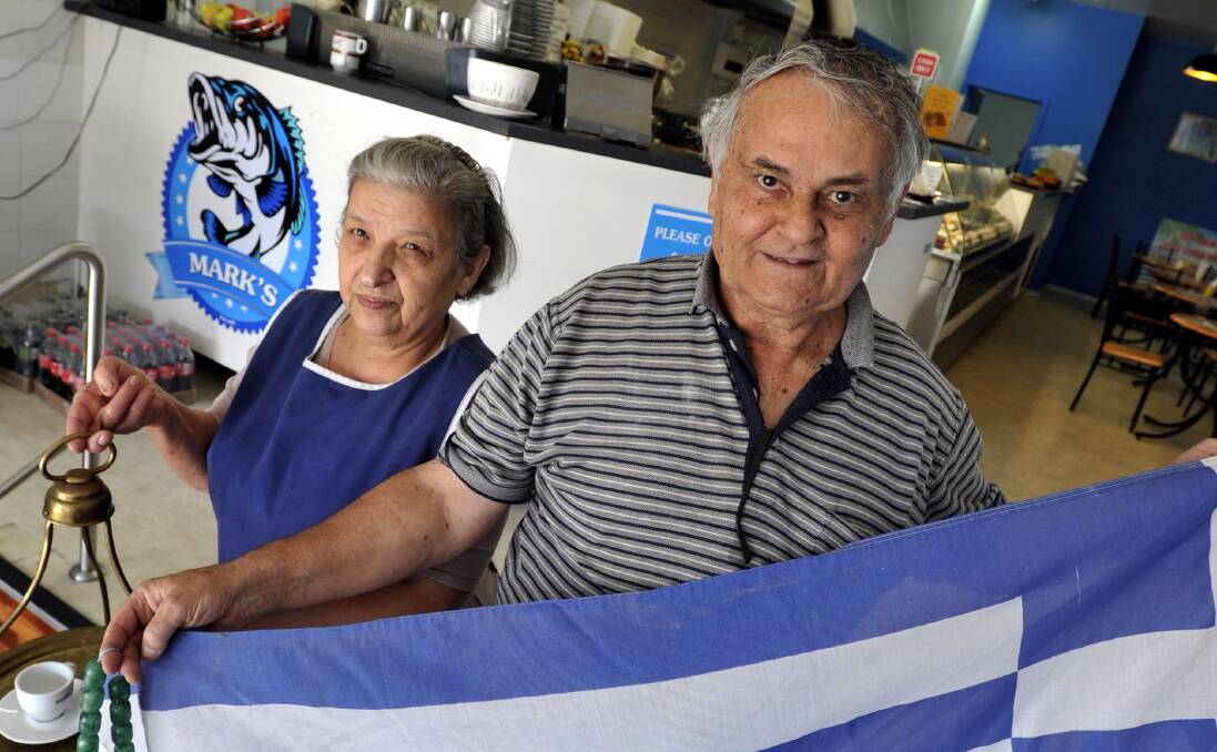 GREECE LIGHTNING: Mark and Georgina Konstance show some patriotism at their Gurwood Street takeaway shop. Picture: Les Smith