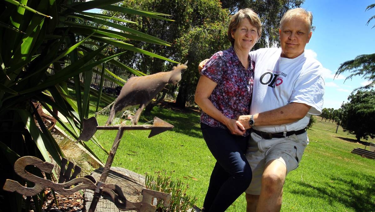 THE GREATEST GIFT: Patrick Tenison at home with his wife, Faye, five years after receiving the double lung transplant that saved his life. Picture: Les Smith