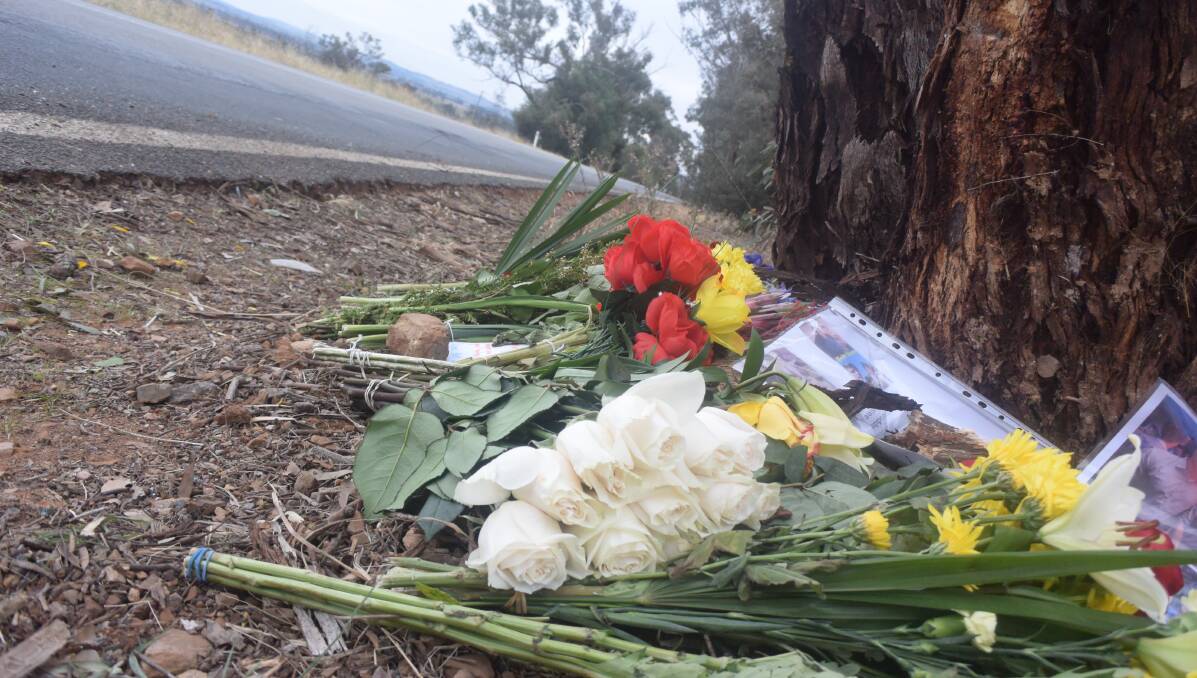TRIBUTE: Flowers left by the road at the scene of the crash on Monday. Picture: Brodie Owen