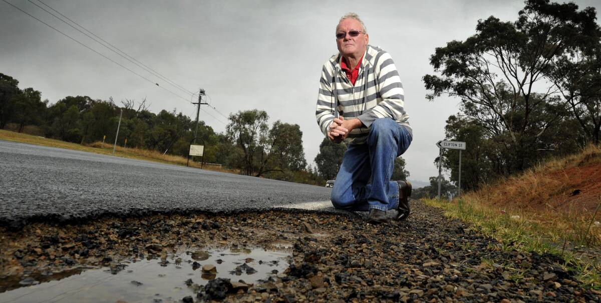 HAZARD: Gary Gurtner hit the pothole at the intersection of Holbrook Road and Clifton Street in November that is still there six months later. Picture: Les Smith