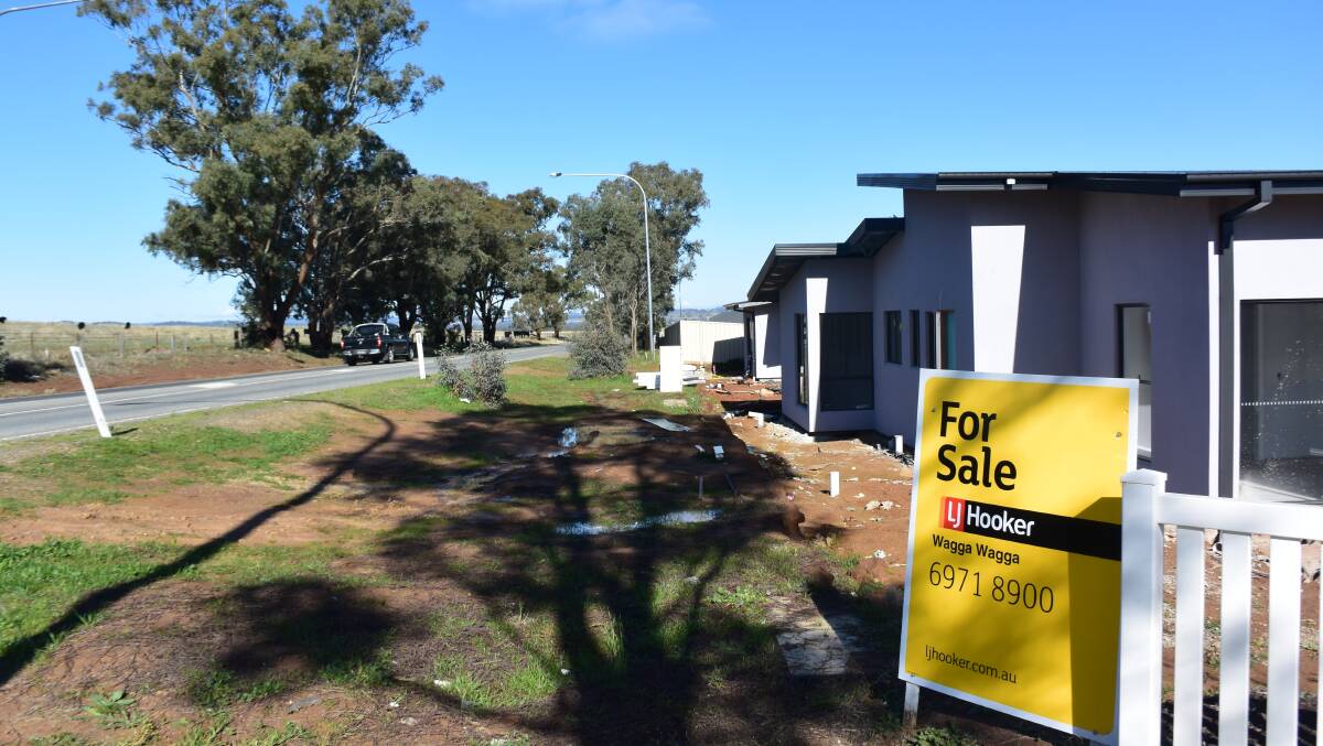 URBAN SPRAWL: The Estella Rise development borders the 100km/h section of Pine Gully Road. Picture: Brodie Owen