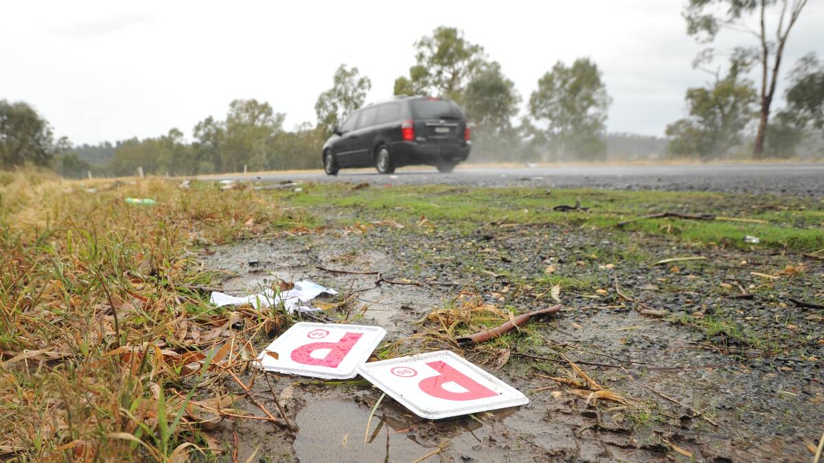 TRAGIC: P-plates lie resting on the road the morning after the fatal accident on the Sturt Highway. Picture: Laura Hardwick