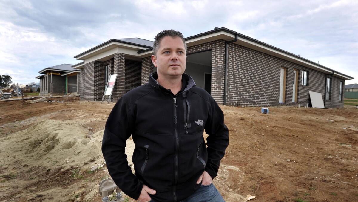 TREE CHANGE: Brendon Jones inspecting his new home at Brunslea Park on Tuesday, which he will soon move into to escape the Sydney 'madhouse'. Picture: Les Smith