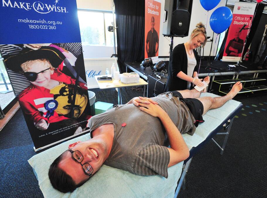 WAX OFF: Dylan Oliver, a second year social work student from Cowra gets waxed at CSU Crow Bar. Staff and students held the Wax for a Wish event to raise money for the Make-A-Wish Foundation. Picture: Kieren L.Tilly