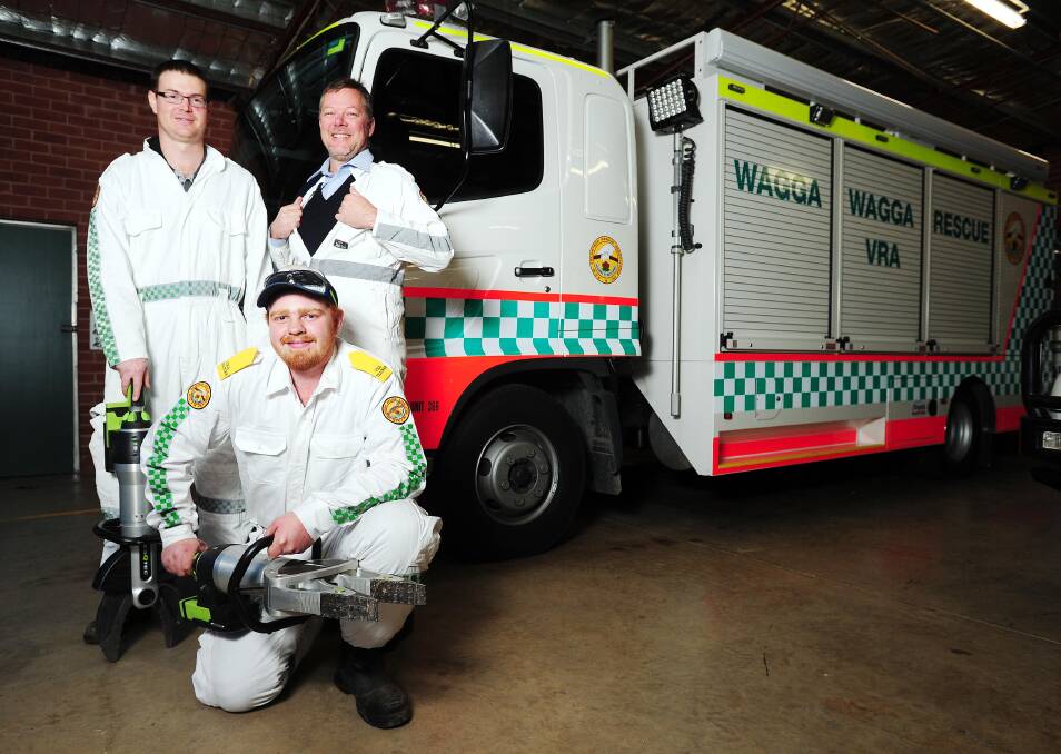 Deputy Captain Lennard Wilson, Volunteer Alex Ford kneeling down and Rescue Operator, Martin Gregory from the Wagga Rescue Squad.