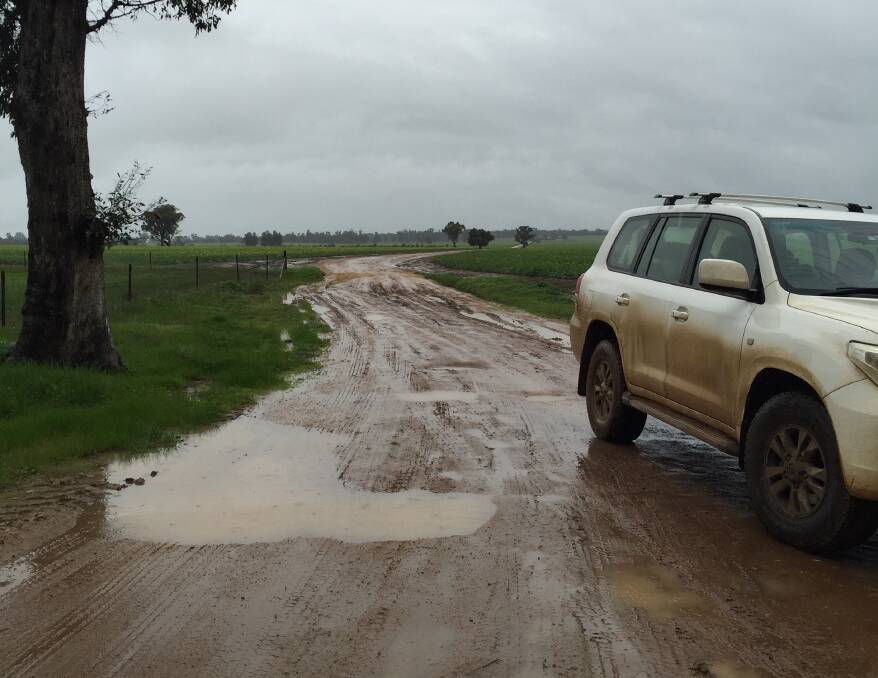 Tootool farmer Katherine Flinn has to drive along three kilometres of muddy road to leave her property, which can sometimes cover her number plates with mud.