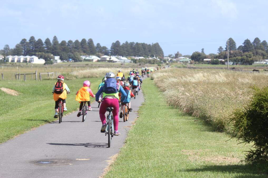 Bike riders on the Warrnambool to Port Fairy rail trail in Victoria.