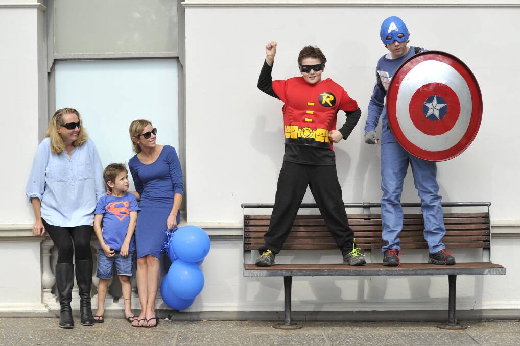 HEROES CALL: (from left) Sheila Buntin, Harrison Gray, 5,  Amy Gray, Robert Buntin, 10, dressed as Robin and Adrian Buntin, 12, dressed as Captain America at last year's Superhero Walk around Lake Albert.