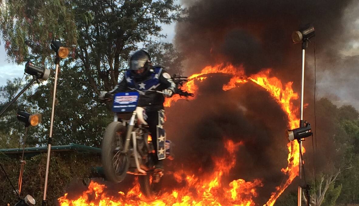 TOO HOT TO HANDLE: Lawrence "Legend" Ryan tests out his burning ring of fire stunt. He has been busy preparing for a 25th anniversary tour celebrating his career as Junee’s own daredevil.