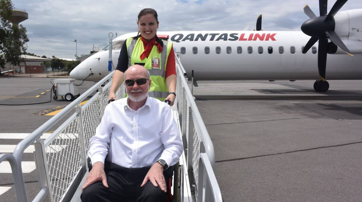 SAFETY FIRST: Qantaslink customer service manager Gemma Rutter with Wagga ground handling company director Gil McLachlan on the new QRamp. Picture: Shane Manning