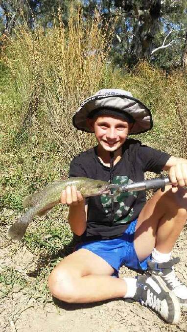 GREAT CATCH: Thomas Clear-Jones shows off a cod caught in the Murrumbidgee. Picture: Contributed