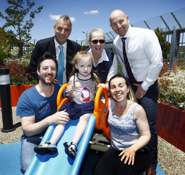 PLAY: (front) The Williams - Ben, Ella, 3, and Lucy - with (back) hospital corporate and business services manager Michael Morris, nursing unit manager Pam Rawle and International Hotel manager Joel Berrigan. Pictures: Les Smith