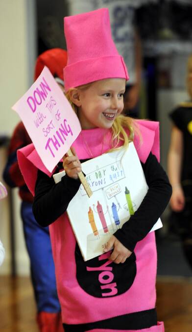SPLASH OF COLOUR: Elyse Pike, 6, dresses up as a pink crayon at the Henschke Primary School Book Week parade. Picture: Les Smith