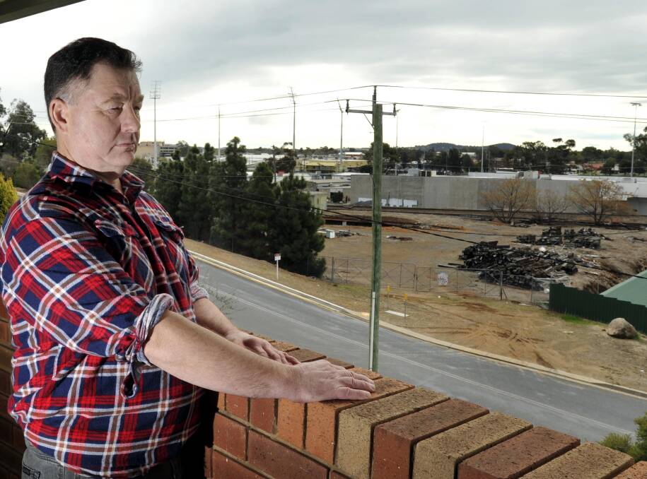 MESS: Railway Street resident Danny O'Hare says the rail yard is in a terrible state. Picture: Les Smith
