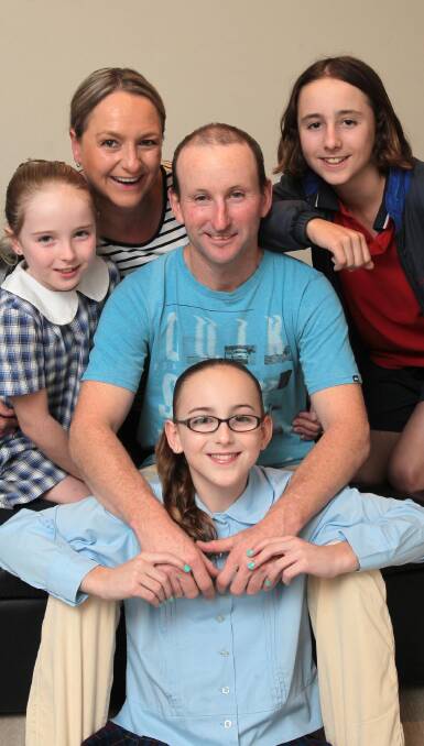 FINAL FLING: Andy Bloomfield (centre) with wife Lisa, son Mitchell, 15, and  daughters Emily (left), 9, and Sophie, 12, at home in Wagga on Tuesday. Picture: Les Smith