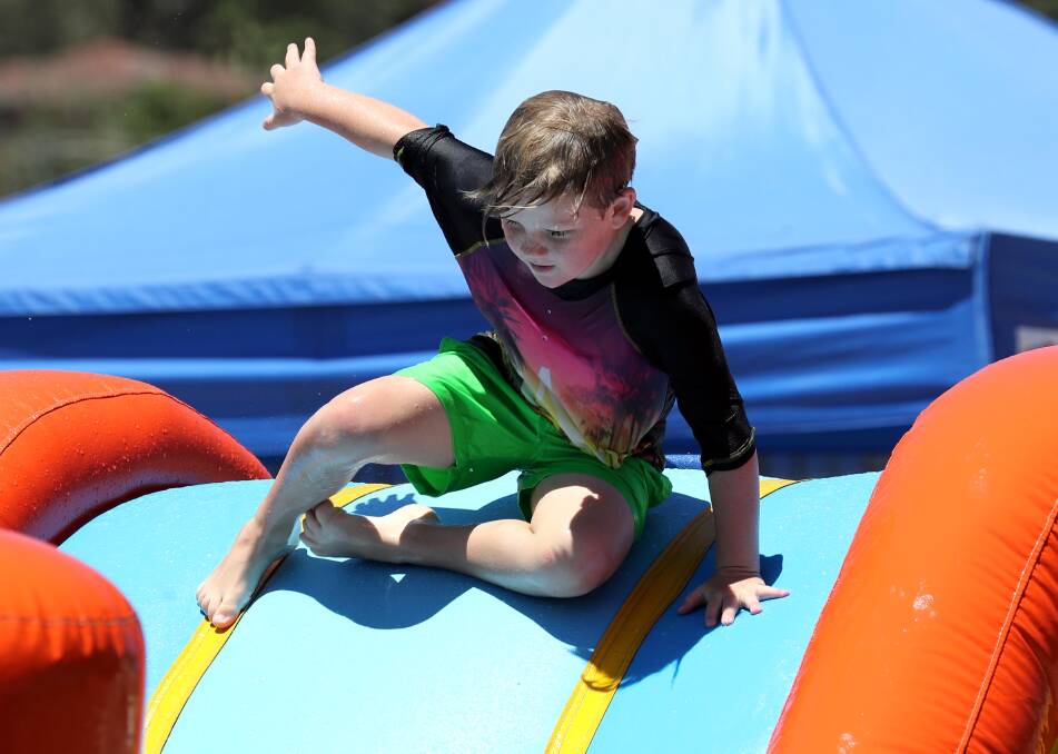 SUMMER FUN:  Kaleb Lyson, 10, of Wagga has some school holiday fun while cooling off at the Oasis Aquatic Centre. Picture: Les Smith
