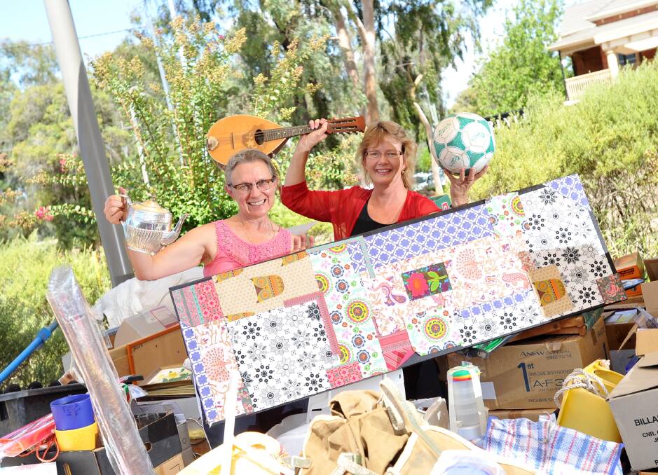 Sally Padgett and Janine Menzies get ready for the 2016 monster garage sale, which has become a Wagga tradition.