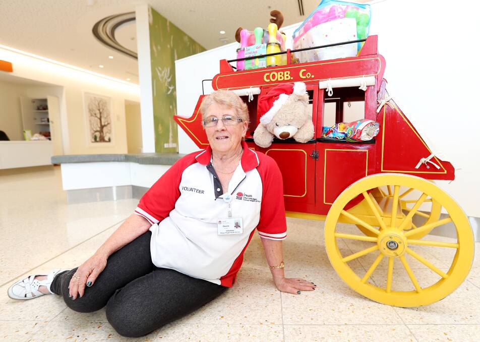 CHRISTMAS RAFFLE: Wagga Rural Referral Hospital volunteer Brenda Shone with the donated coach. Picture: Kieren L. Tilly