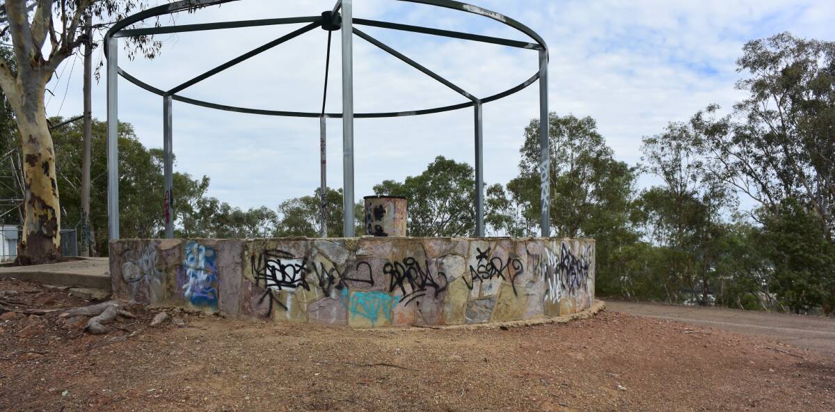 UNKEMPT: The graffiti-covered lookout at the top of Willans Hill, off Capital Cook Drive. A nearby resident says illegal dumping and vandalism is a frequent problem.