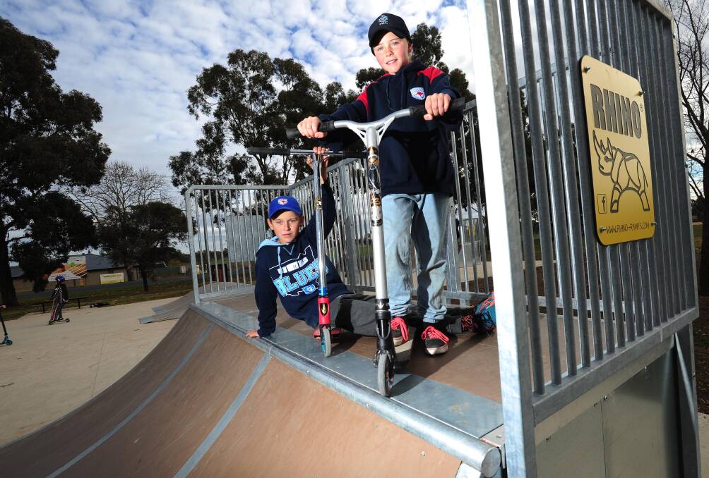 RAMPED UP FUN: Brad, 11, and Kassie Hiscock, 9, try out the new Forest Kill skate park. Picture: Kieren L. Tilly