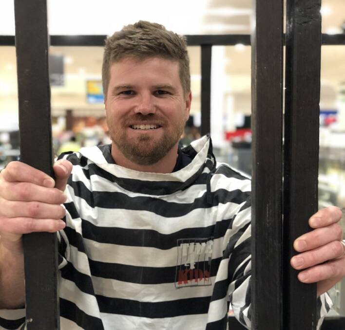 LOCKDOWN: Being behind bars like an old-school "convict" is not everyone's cup of tea, but Peter Braneley from Ron Crouch Transport took it in his stride.