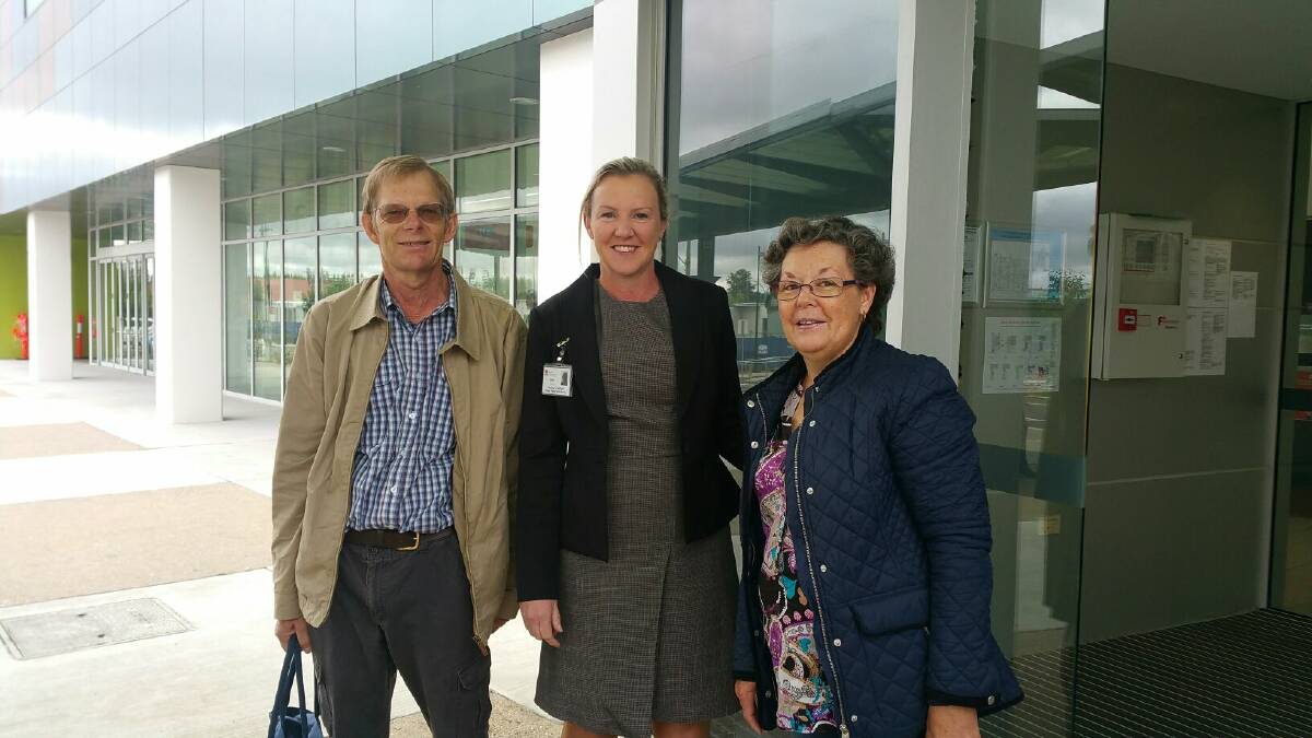OPEN: Gary Johnson and Margaret Campbell, pictured with Wagga Health Service director Helen Cooper, were the first people to officially use the entrance.