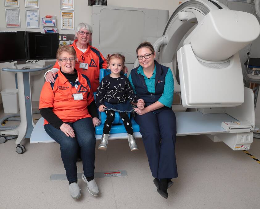 NEW SERVICE: Hospital volunteers Lise Chan (back) and Brenda Shone, speech therapist Rachael Lawrence and four-year-old Kailyn Fitzpatrick with one of the new paediatric chairs. Picture: Kieren L Tilly