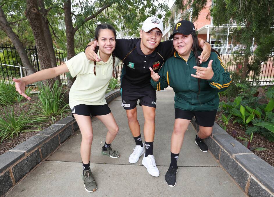 FUN TIMES: Trianda Biggs, Jordan Everingham and Djaneeka Biggs, from Mount Austin High School, are still smiling about their participation in the 2017 Schools Spectacular. Picture: Kieren L Tilly