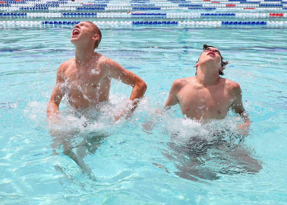 Malcolm Charles, 15, and his best mate Cameron Palmer, 14, cool off at Wagga's Oasis swimming centre. Picture: Kieren L Tilly