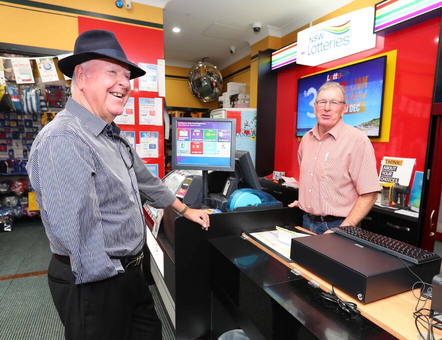 RENOVATED: Wayne Carroll of Cignall chats to Terry Ahern about the expansion of the business to become a sub newsagent and a NSW Lotteries agent. Picture: Kieren L Tilly