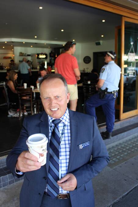 MORNING BOOST: Inspector Phil Malligan was among the Wagga police officers chatting to the community at Cafe Sonder on Thursday.