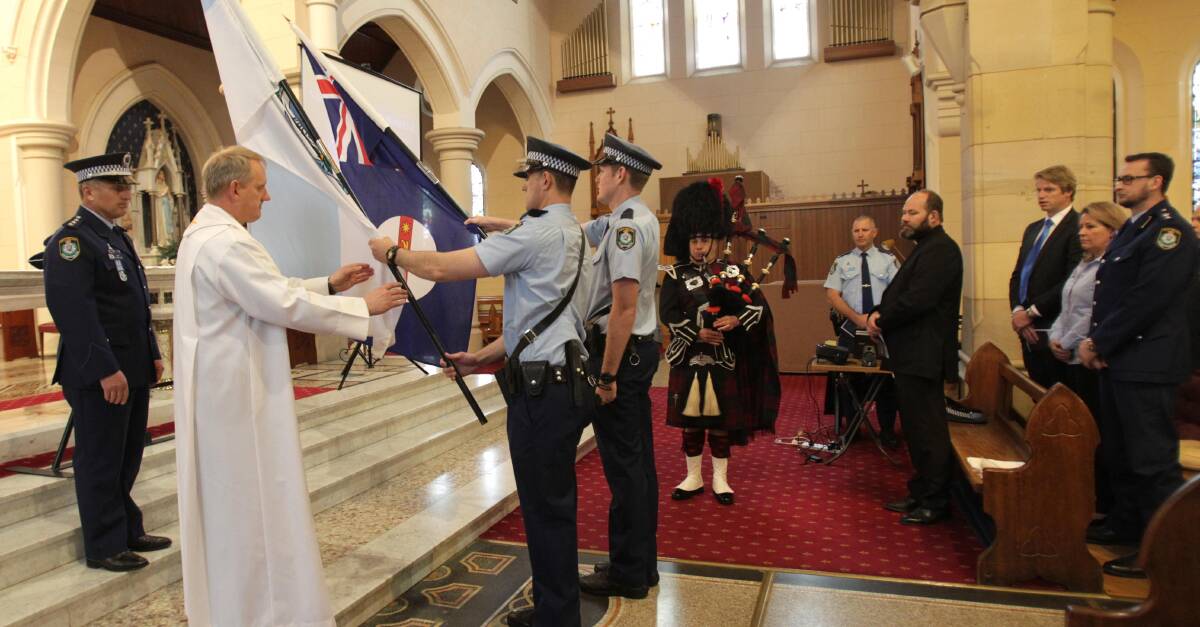PAYING RESPECT: Wagga police officers and community figures gather at the St Michael's Cathedral to honour their colleagues who made the ultimate sacrifice.